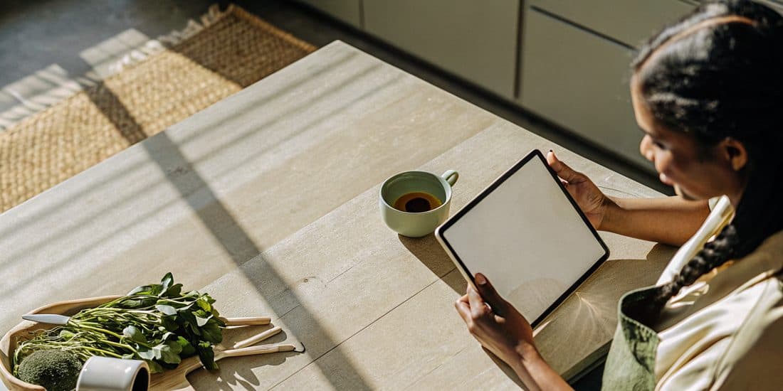 A woman reviewing her personalized, DNA-informed wellness roadmap at home